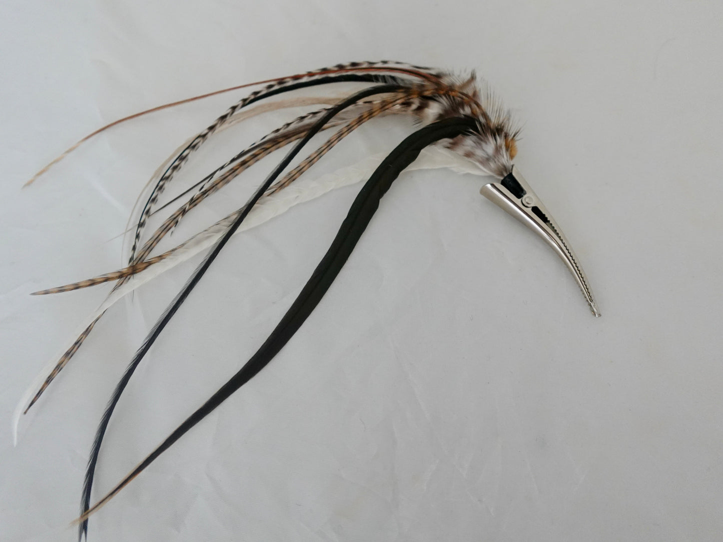 Feather clip in black and white and neutrals on silver, medium sized