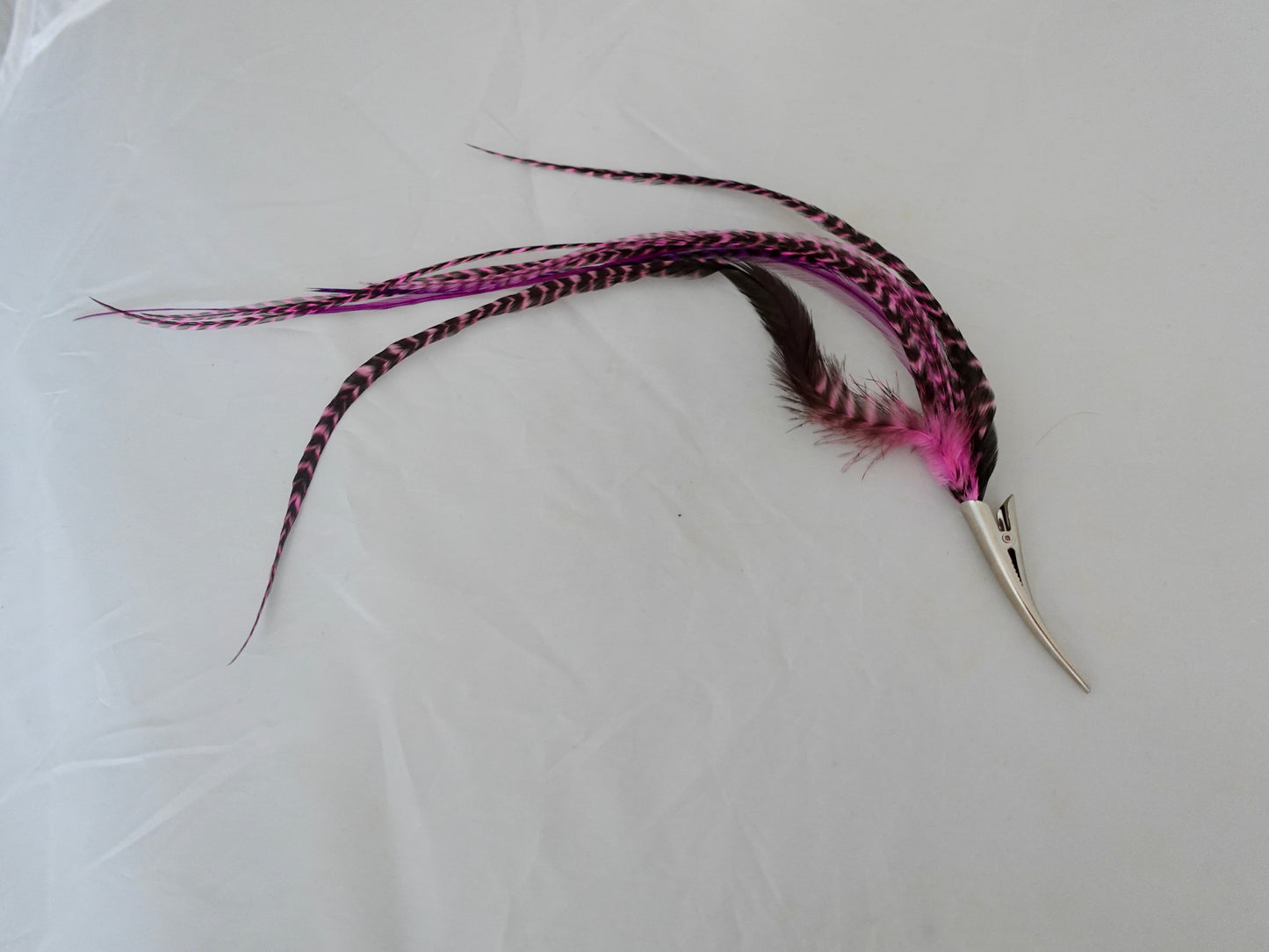 Feather clip in pinks on silver, medium sized