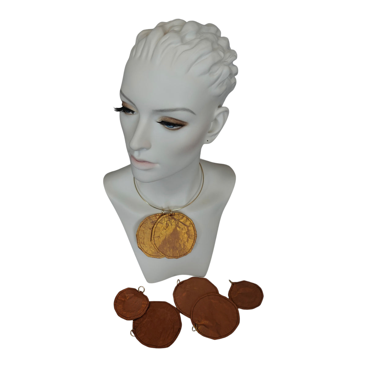 a mannequin head with a necklace