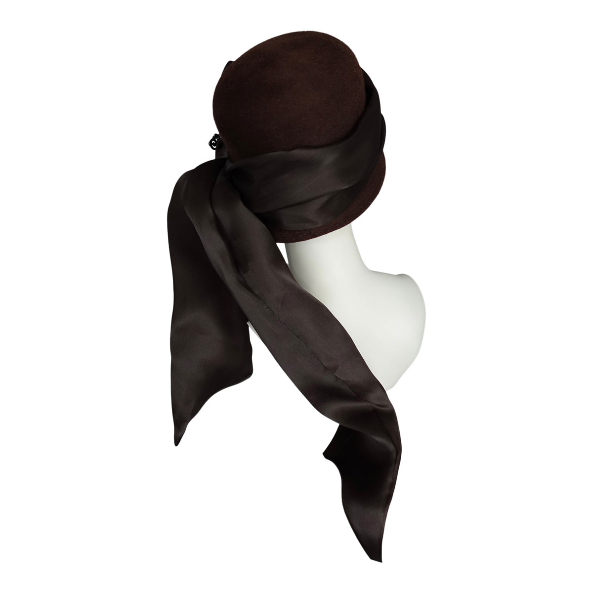 a hat with a scarf on the head